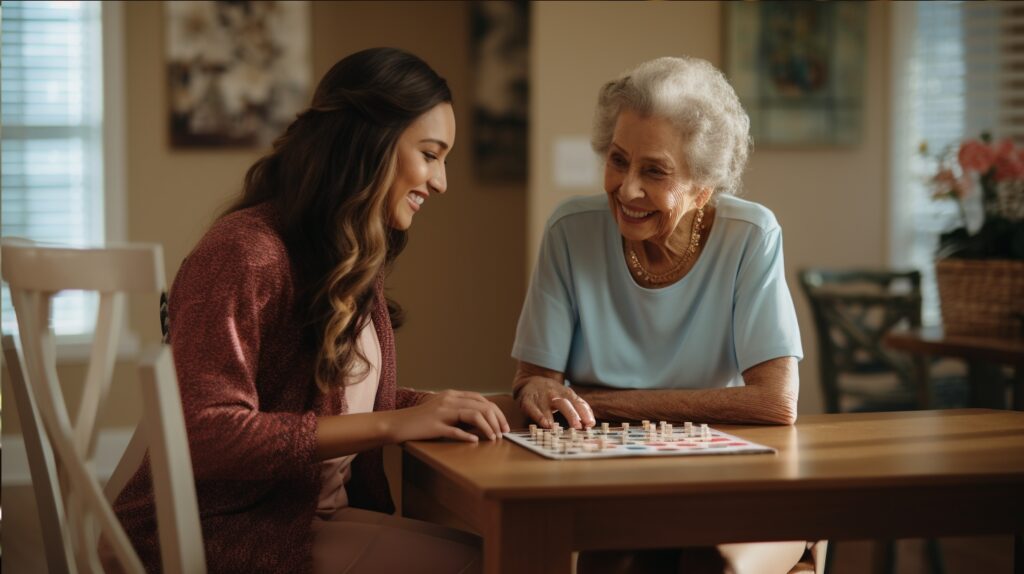female caregiver with an elderly woman at her home in Ohio playing a table game in a living room